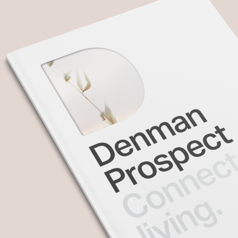 A Denman Prospect brochure on a beige-pink background.